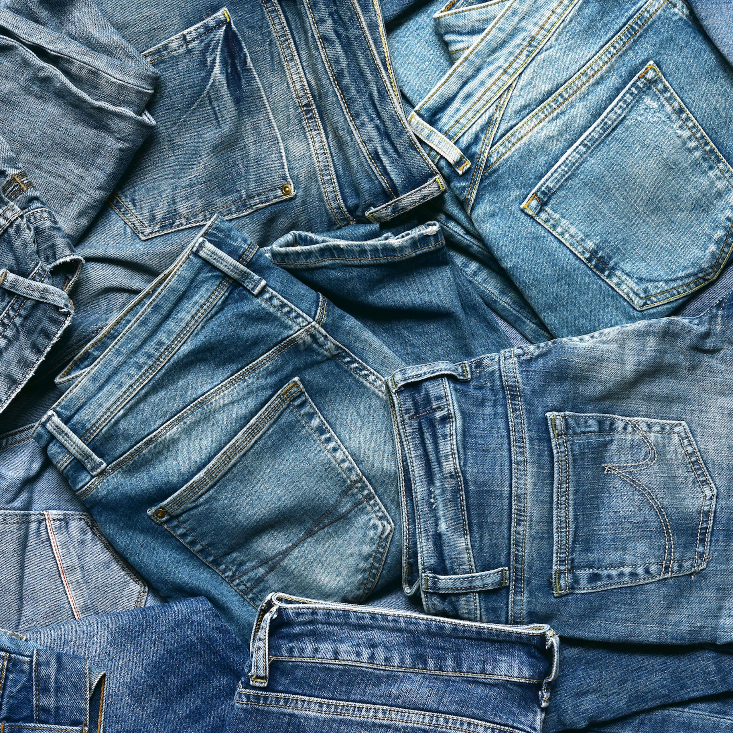 pile of denim jeans