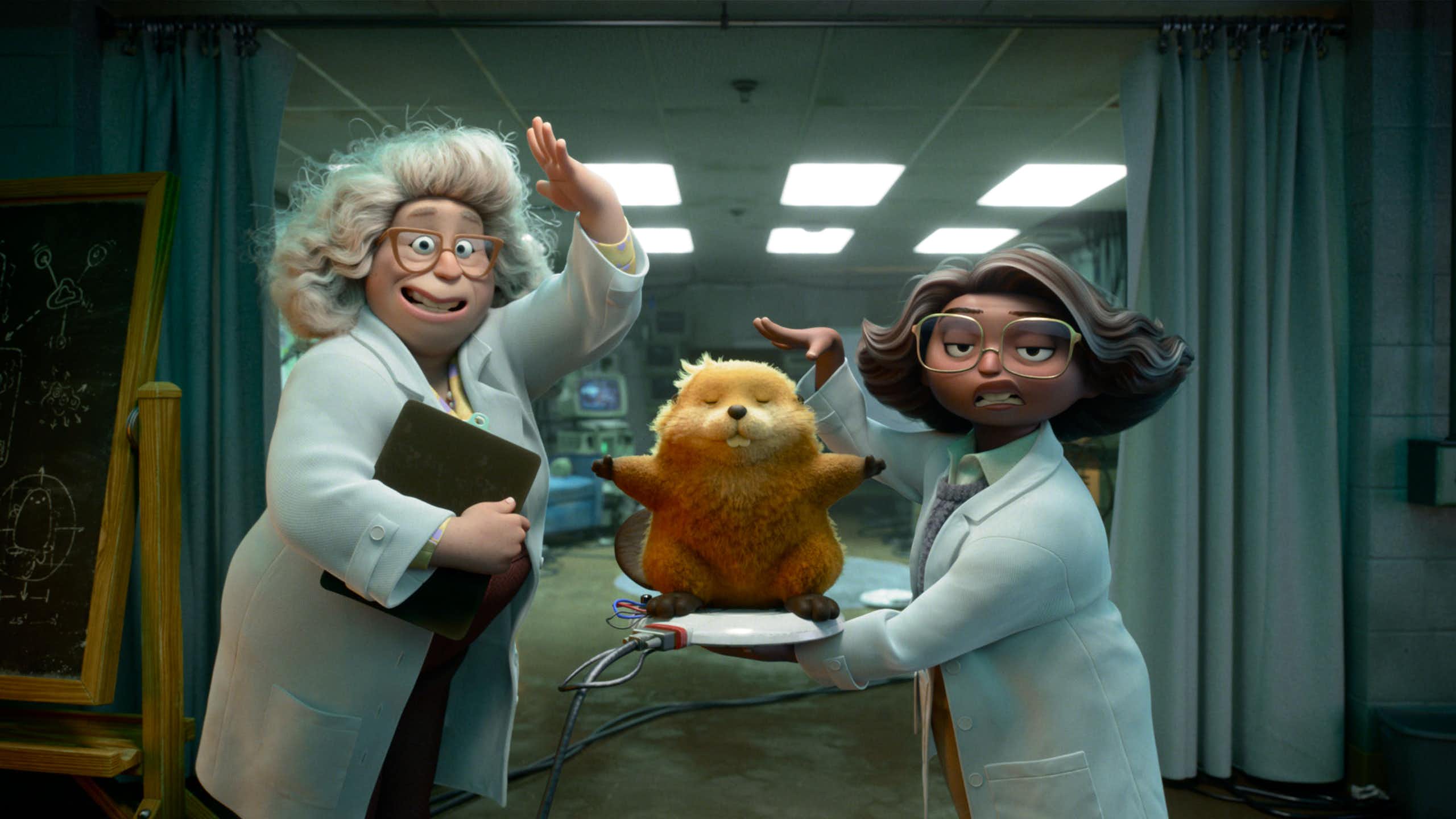 Film still: two women scientists and an animatronic beaver. 
