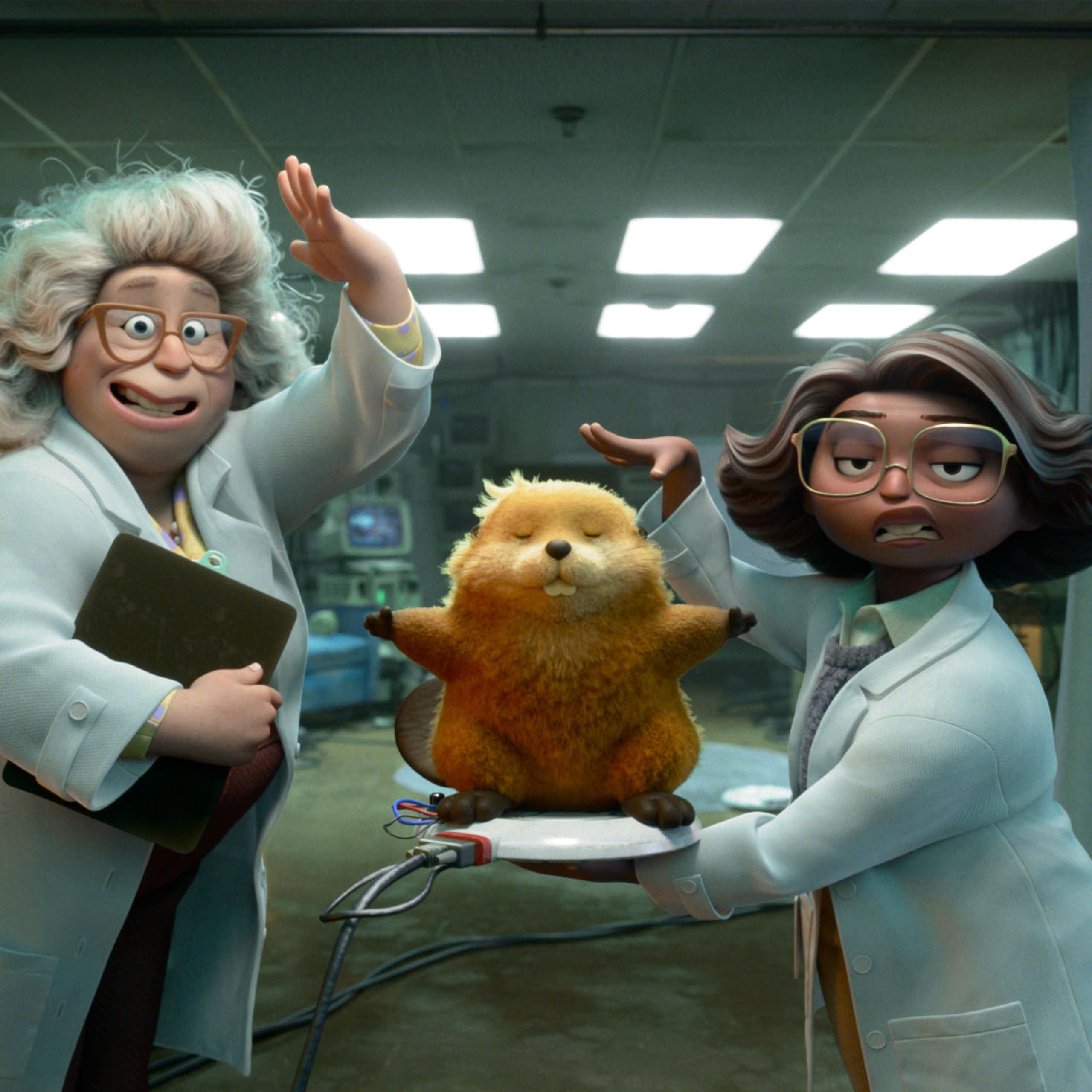 Film still: two women scientists and an animatronic beaver. 