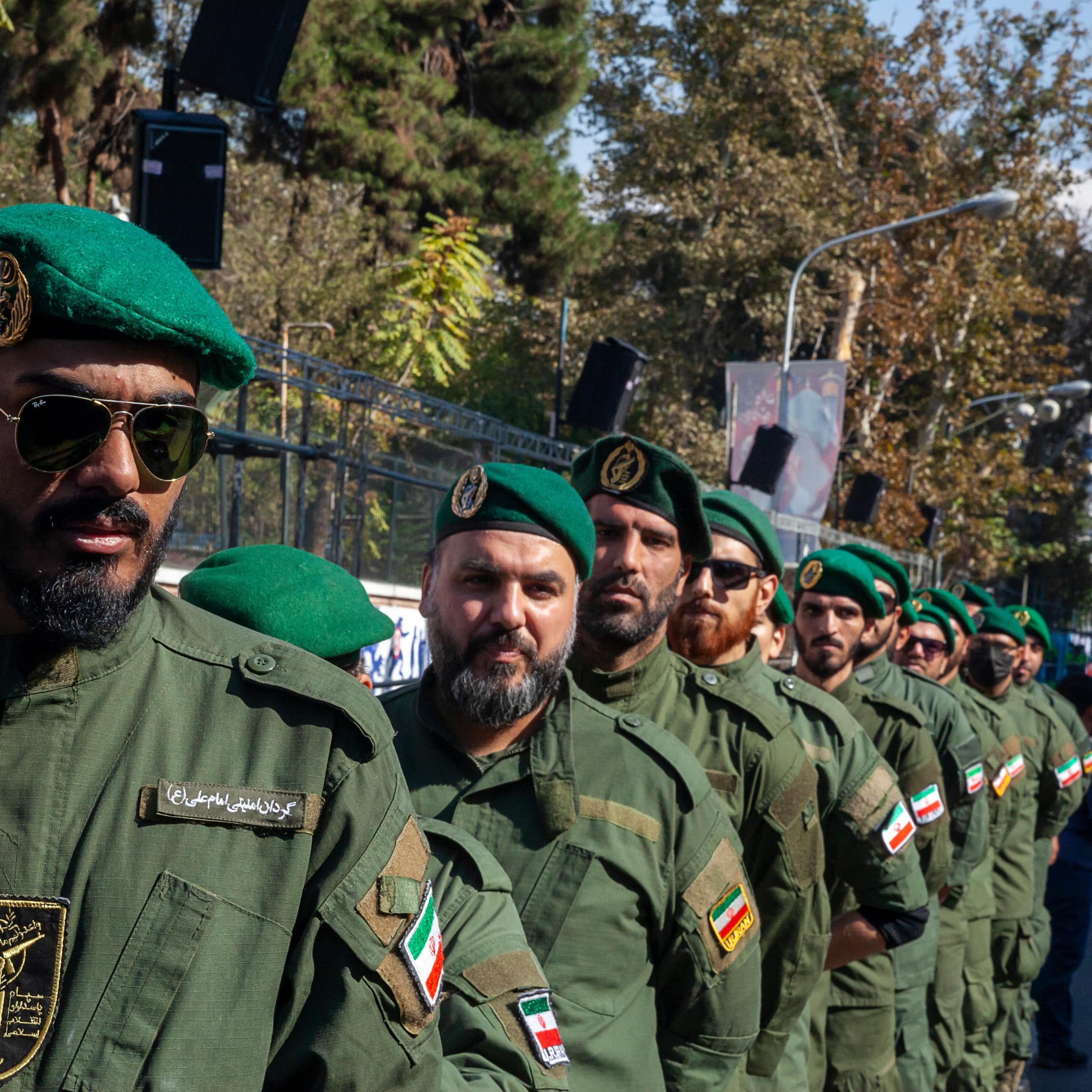 a row of soldiers dressed in green