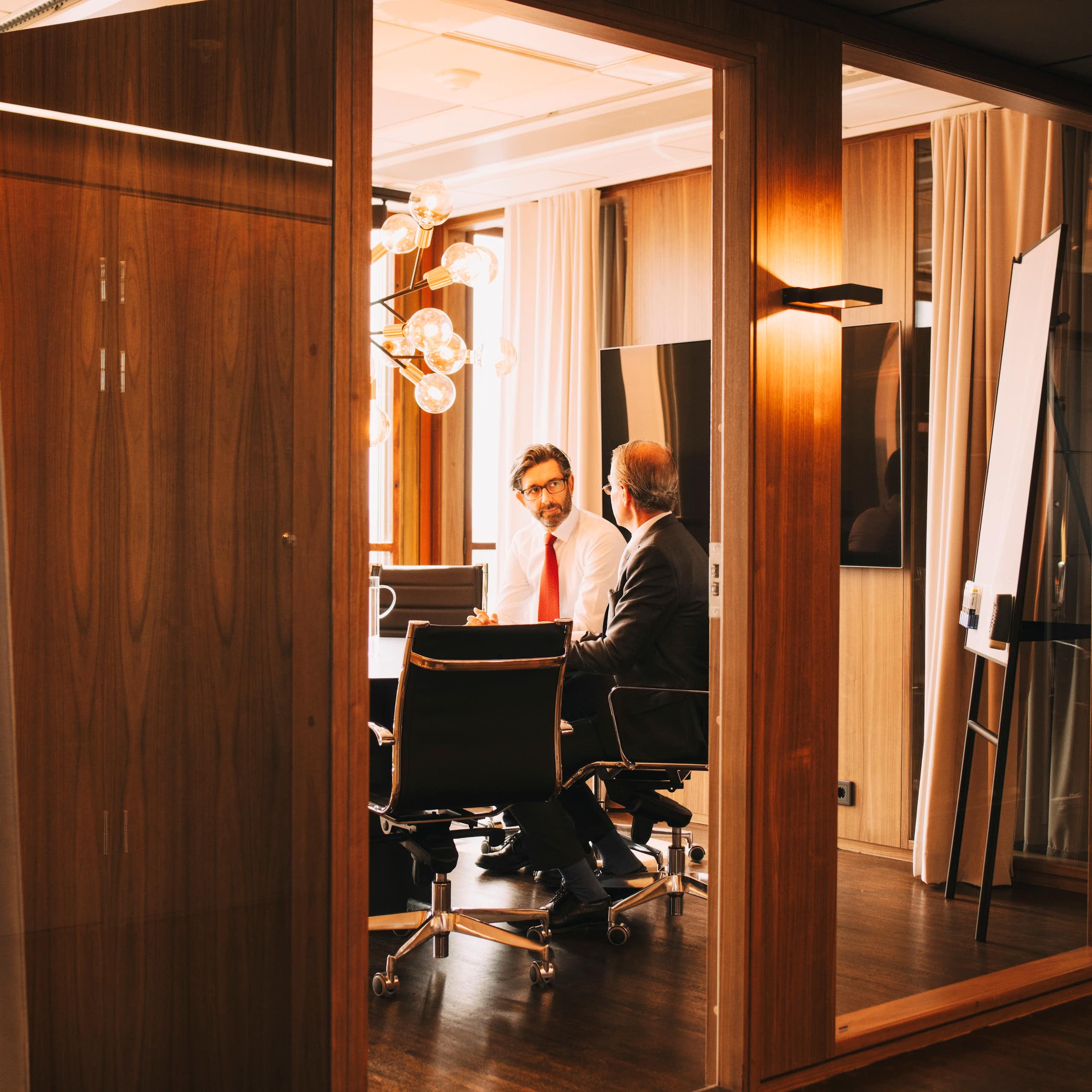 Men having a discussion in a boardroom