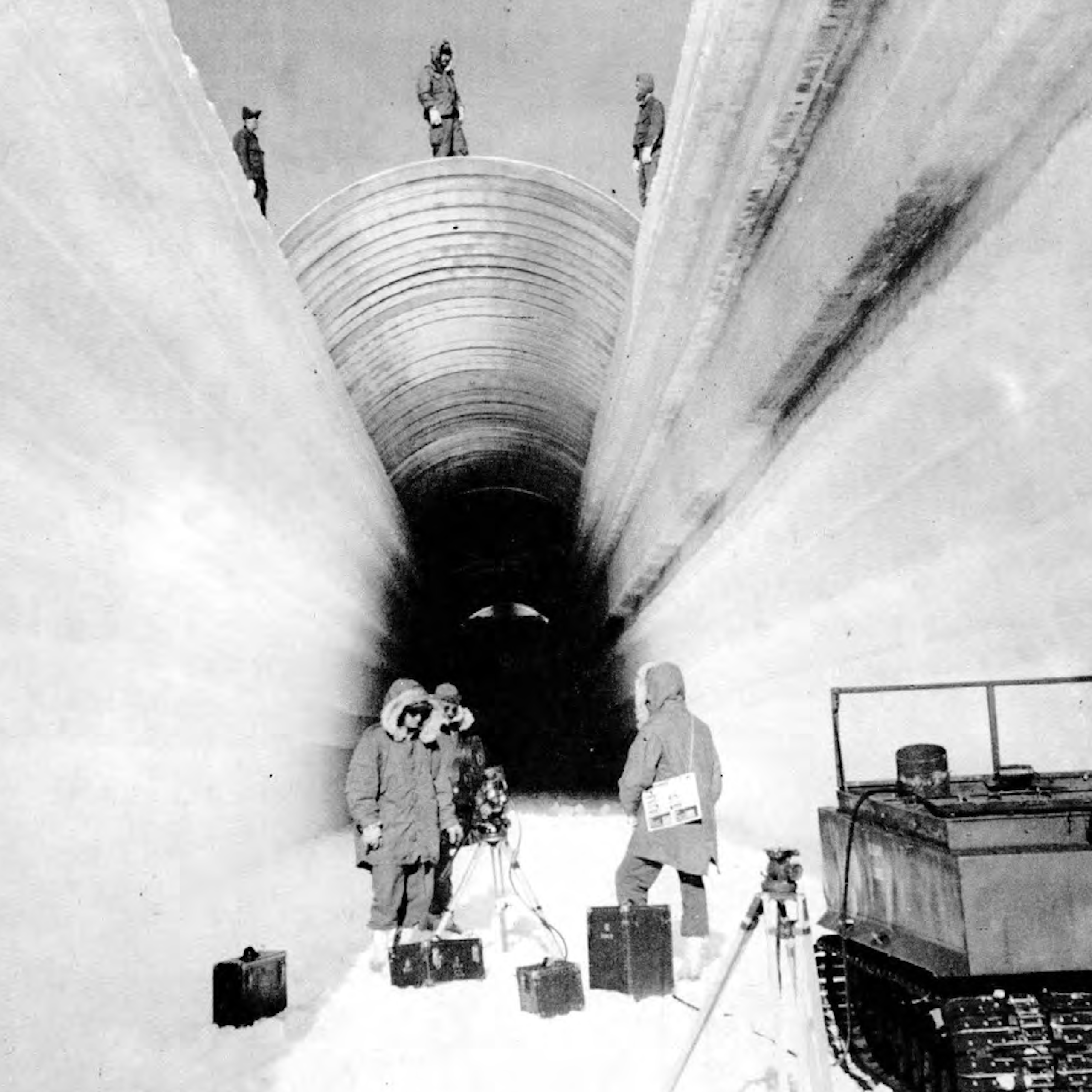 US soldiers digging tunnels in the snow in Greenland in the 1960s.